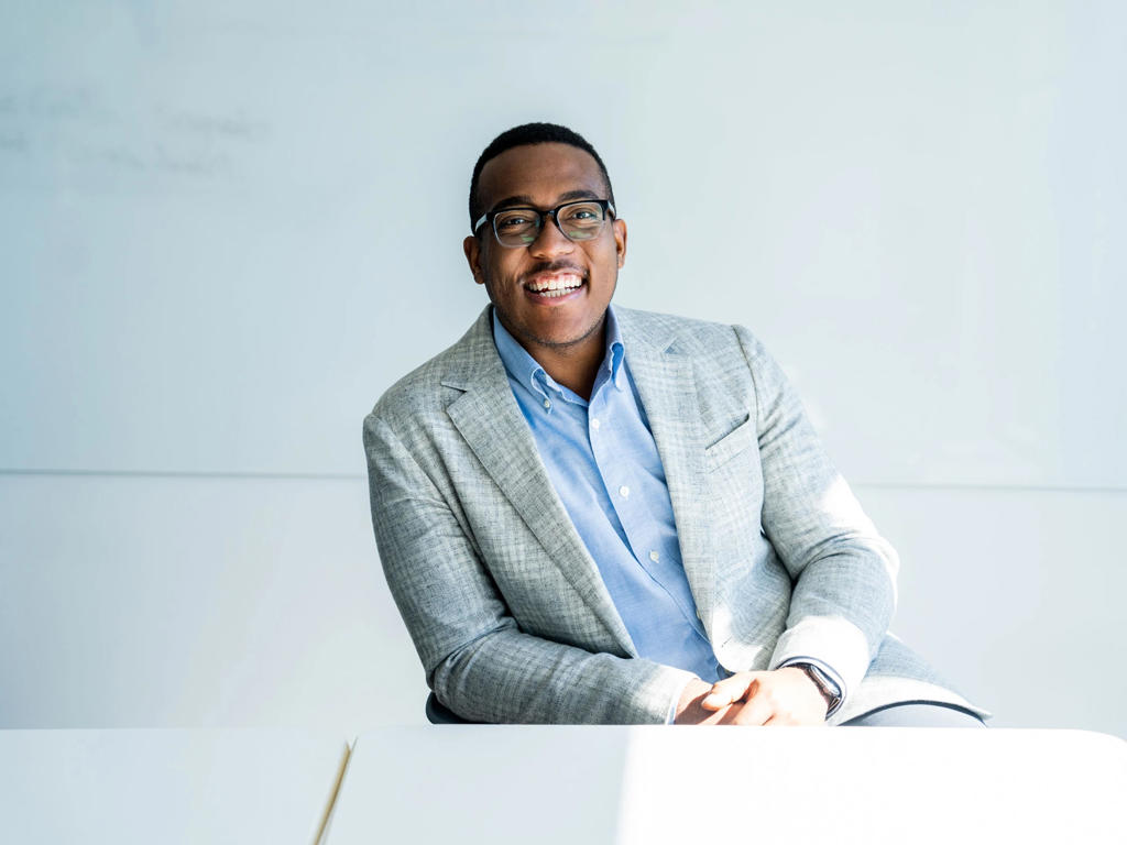 Smiling young professional in an office setting