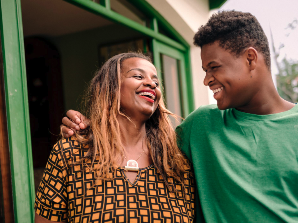 A man and a woman embracing and smiling