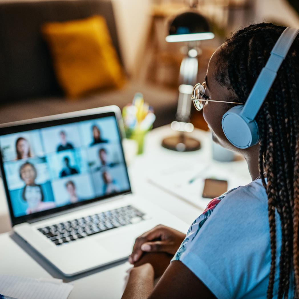 A woman is on a video conference call at work