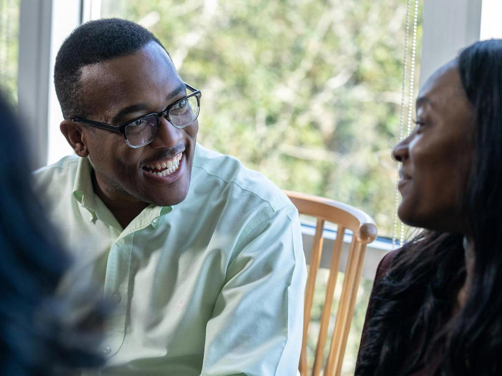 2 people talking and laughing