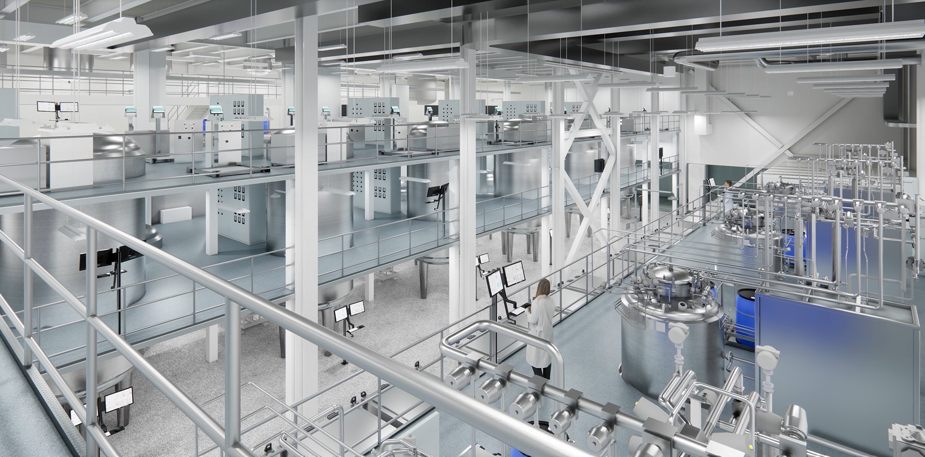 Person standing in front of computers in a large biomedical facility