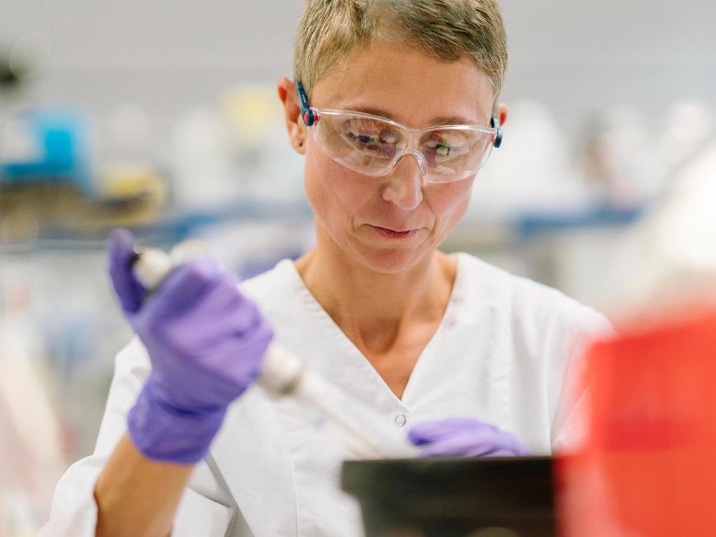 JJ Photo Scientist Holding Lab Instrument IM 4Star