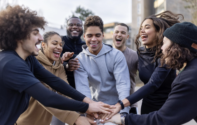 Happy group of college students celebrating