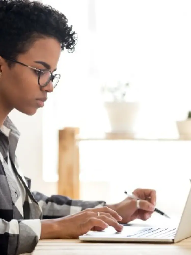 A person works on a laptop