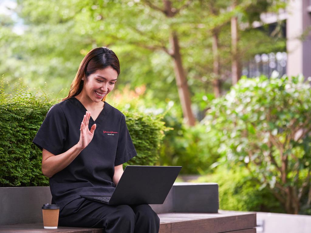 JJ Photo Woman In Scrubs Taking A Meeting Outdoors JJ 1Star (1)