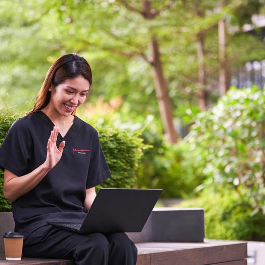 JJ Photo Woman In Scrubs Taking A Meeting Outdoors JJ 1Star (1)