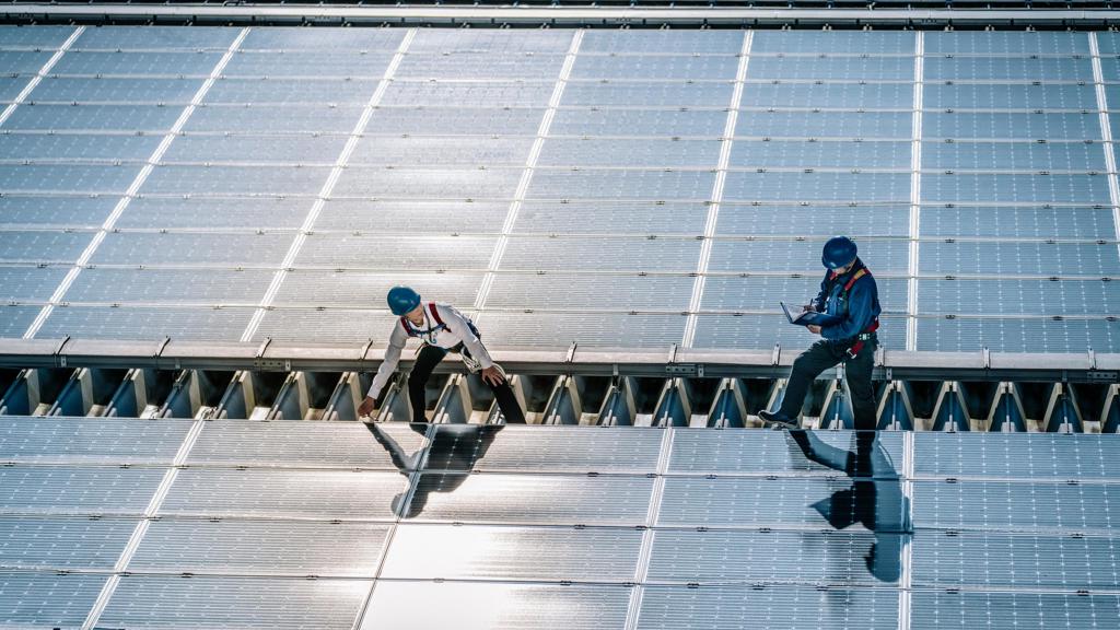 JJ Photo Two Men Checking On Solar Panels IM 4Star