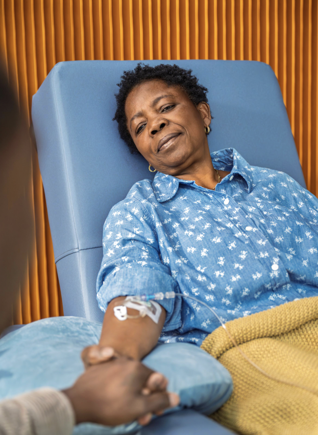 An ailing family member squeezes the hand of a loved one