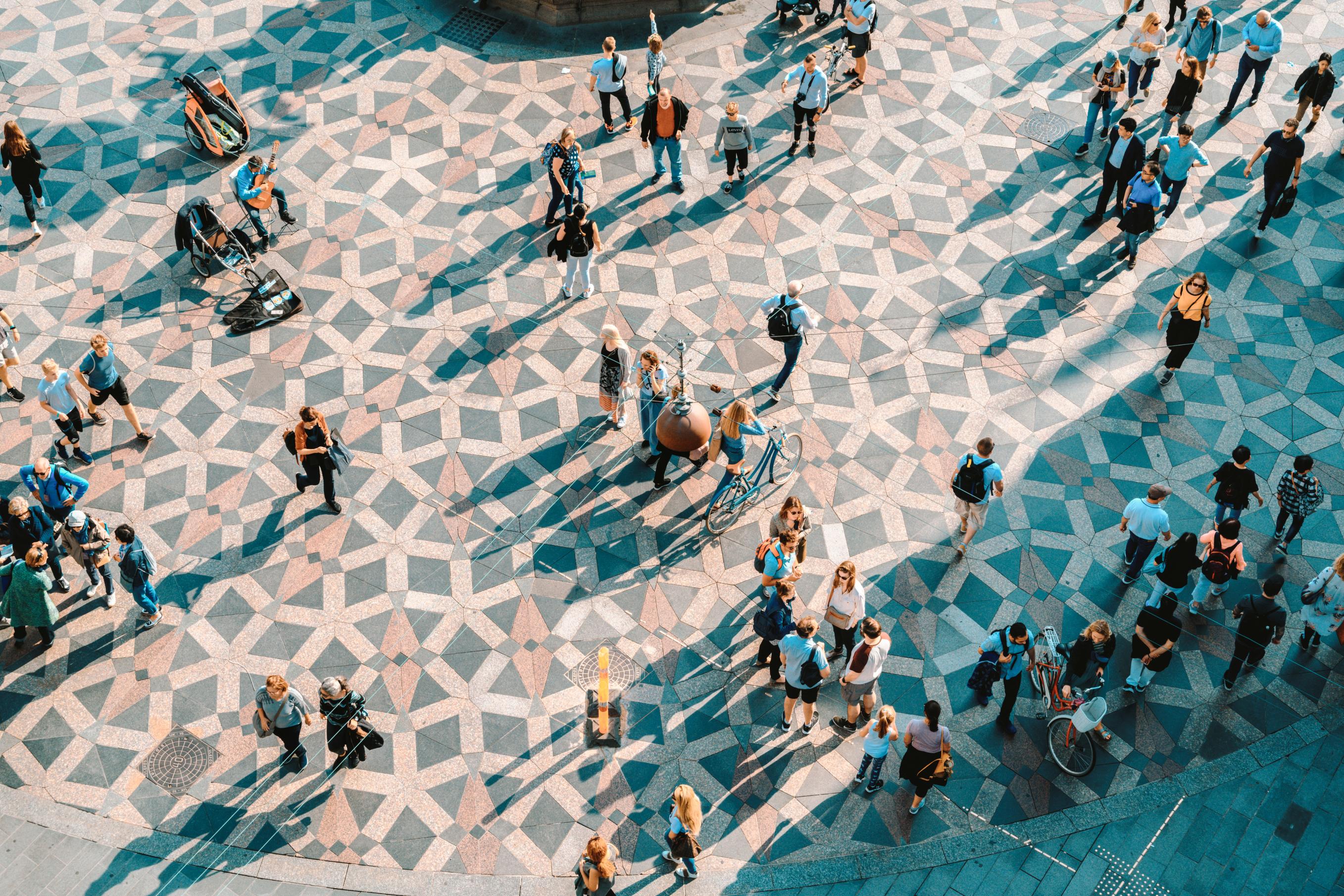 JJ Photo Aerial View Of People Walking In City Square Gettyimages 1156746973 4Star (1)