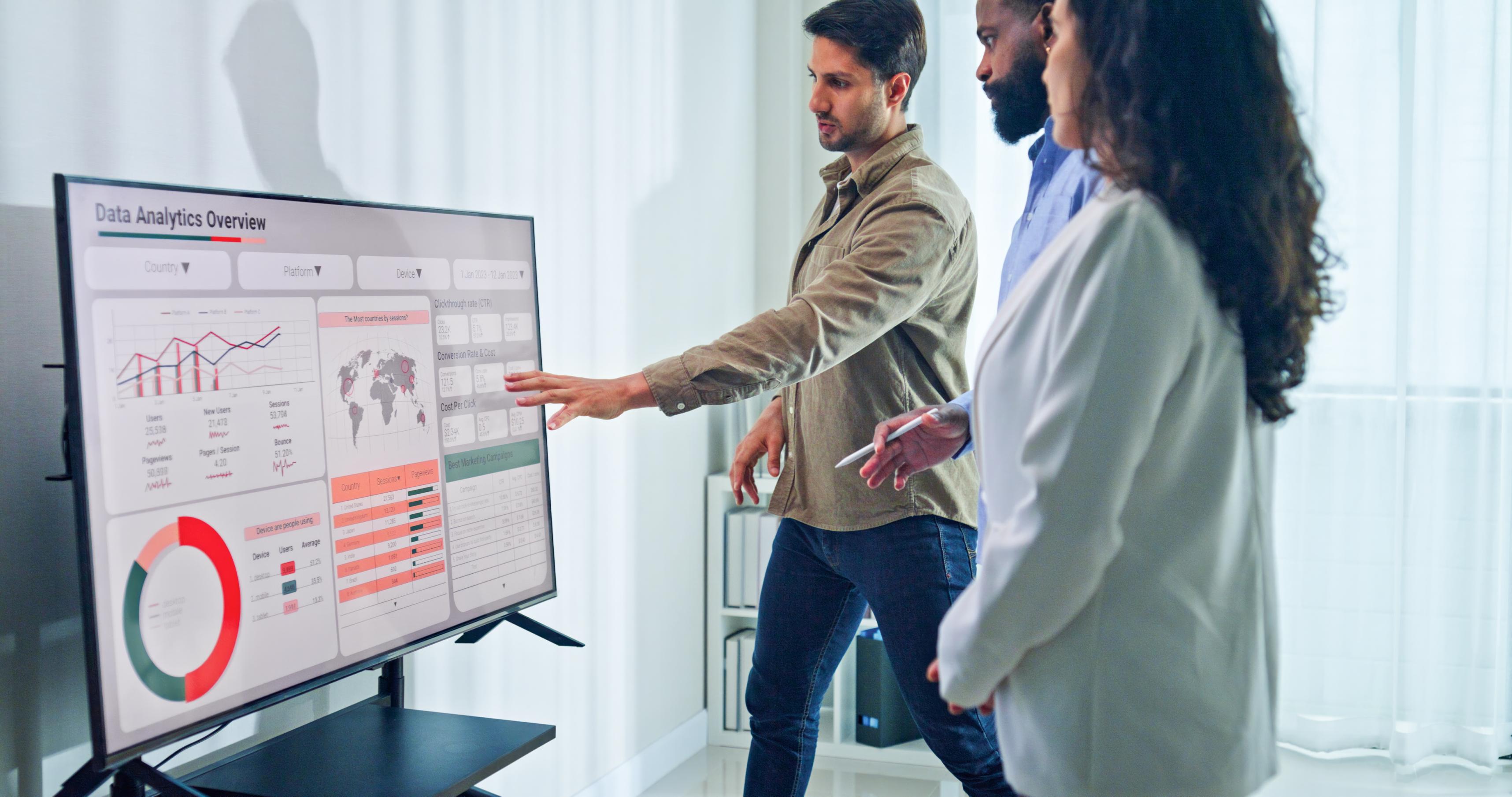 Group Of Business Professionals Reviewing Global Data Analytics