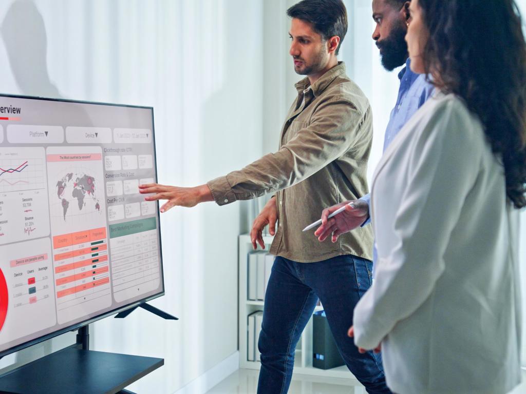Group Of Business Professionals Reviewing Global Data Analytics