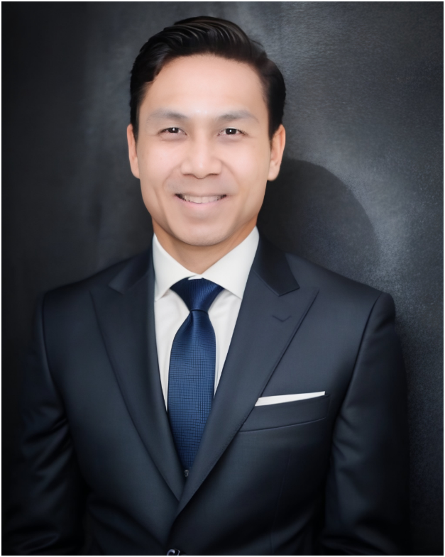 A portrait of a man in a dark suit