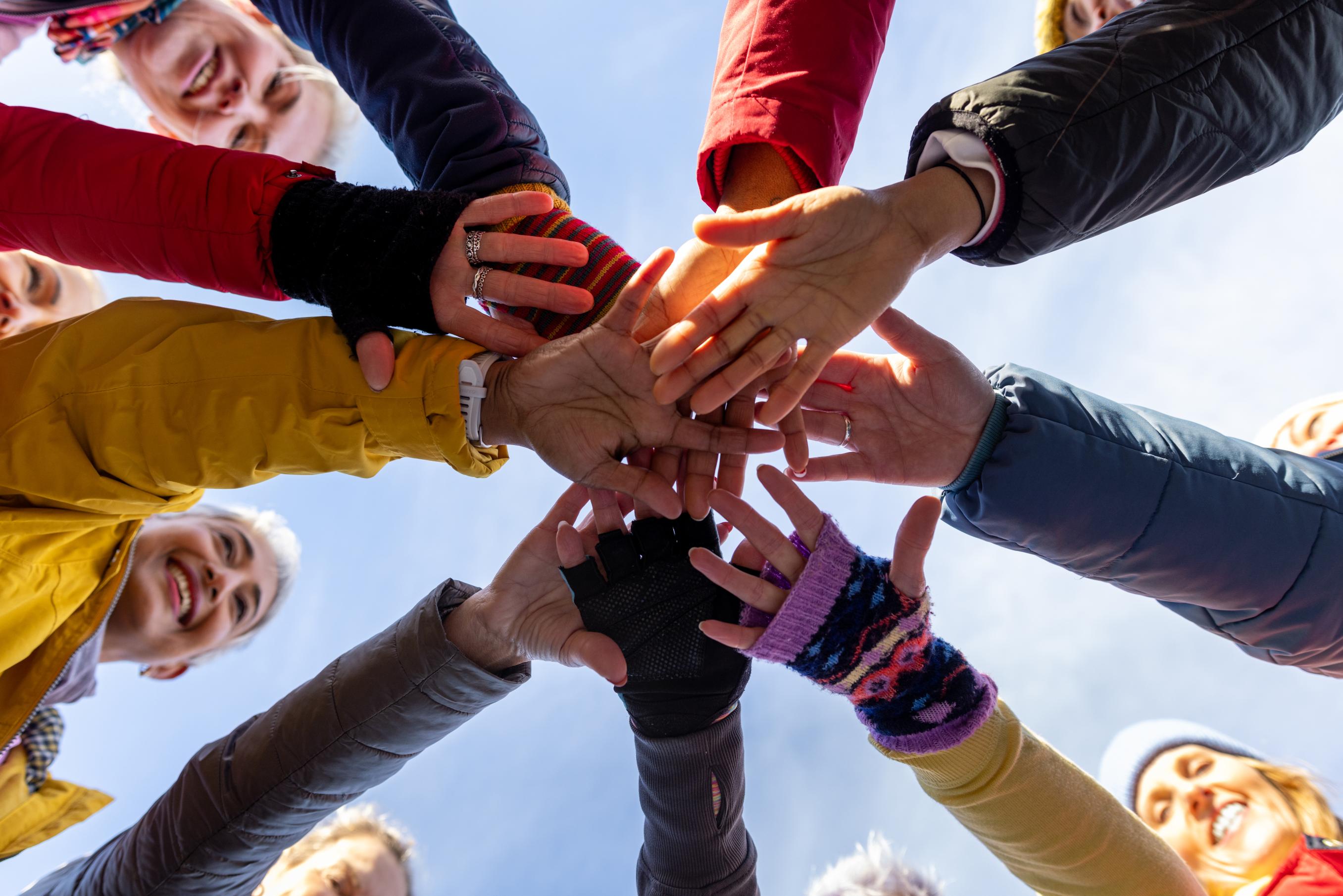 A group of excited people in a huddle