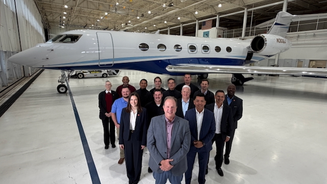 The J&J Aviation team standing in front of an airplane