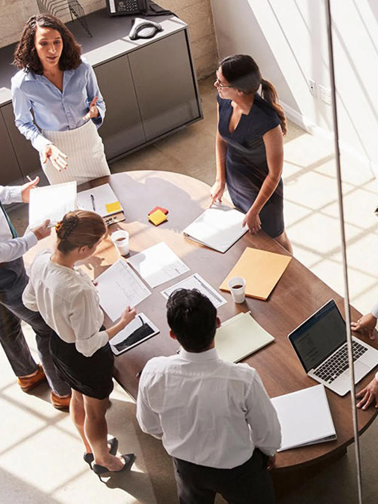 Birds-eye-view of a team collaborating at J&J