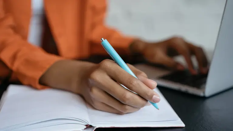 image of someone drafting a letter