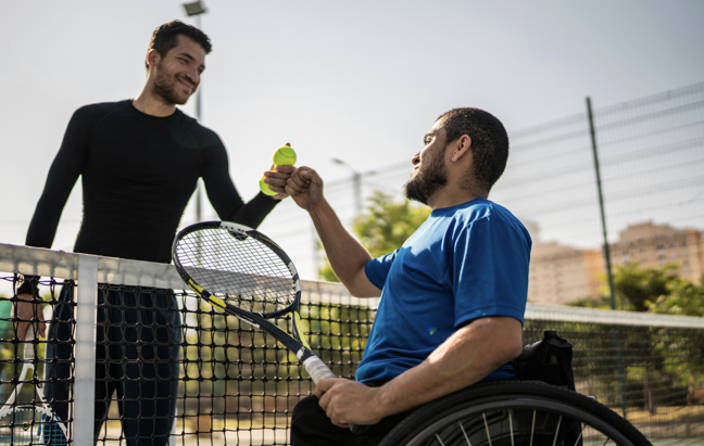 Happy tennis players meeting at the net